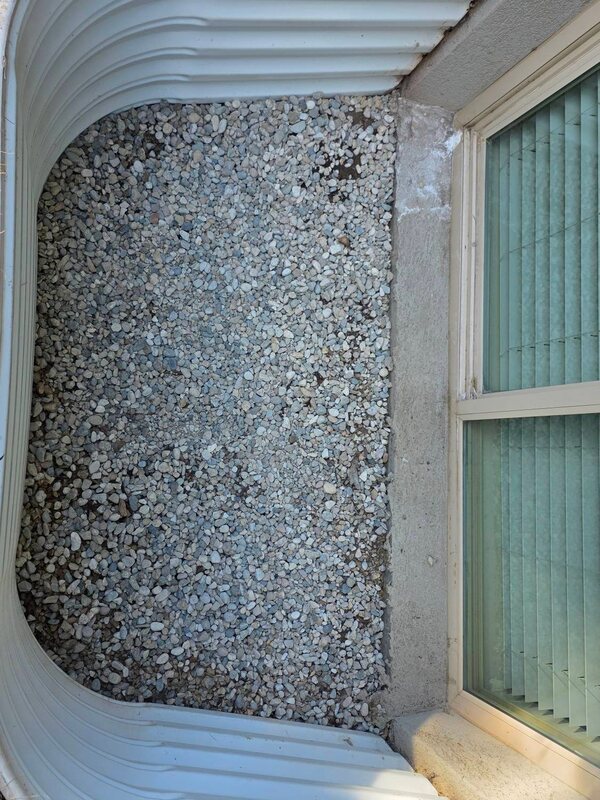 Clean window well with fresh drainage rocks after cleaning